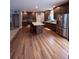 Open-concept kitchen features a center island, wood cabinets, and stainless steel appliances at 2460 Bama Rd, Cottageville, SC 29435