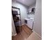 Efficient laundry room featuring a washer, dryer, and storage shelving at 2460 Bama Rd, Cottageville, SC 29435