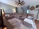 Spacious living room featuring a large sectional sofa, stylish rug, and modern ceiling fan at 2460 Bama Rd, Cottageville, SC 29435