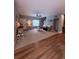 Bright living room with ceiling fan, view of staircase, and lots of natural light at 2460 Bama Rd, Cottageville, SC 29435