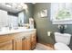 Bathroom featuring a wood vanity, linoleum floors, and tasteful wall decorations at 24678 Augusta Hwy, Cottageville, SC 29435