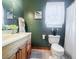 Nicely appointed bathroom featuring vanity, toilet and shower/tub with tasteful decor at 24678 Augusta Hwy, Cottageville, SC 29435