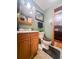 Bathroom featuring sink/vanity with storage and a toilet, leading to a bedroom at 24678 Augusta Hwy, Cottageville, SC 29435