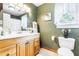 Bathroom featuring a wood vanity, linoleum floors, and tasteful wall decorations at 24678 Augusta Hwy, Cottageville, SC 29435
