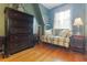 Bedroom with a seating area and a dresser with natural light streaming in through the window at 24678 Augusta Hwy, Cottageville, SC 29435