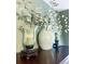 Close up of decorative vases and candle holders on a dark wood dresser, showcasing the room's stylish accents at 24678 Augusta Hwy, Cottageville, SC 29435