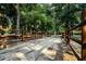 Picturesque gravel driveway framed by a rustic fence, leading to secluded residence at 24678 Augusta Hwy, Cottageville, SC 29435