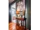 Inviting entryway featuring hardwood floors and an elegant console table with decorative accents at 24678 Augusta Hwy, Cottageville, SC 29435