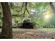Charming log cabin nestled amongst lush greenery and mature trees at 24678 Augusta Hwy, Cottageville, SC 29435