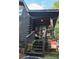 Inviting log cabin front porch with cozy seating and charming decorative touches at 24678 Augusta Hwy, Cottageville, SC 29435