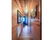 Hallway with warm wood paneling and decorative wall art at 24678 Augusta Hwy, Cottageville, SC 29435