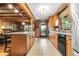 Spacious kitchen with wooden cabinets, granite countertops, stainless steel appliances, and tiled floors at 24678 Augusta Hwy, Cottageville, SC 29435