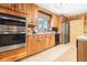 Well-equipped kitchen with stainless steel appliances, custom wood cabinets, and granite countertops at 24678 Augusta Hwy, Cottageville, SC 29435