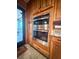 Stainless steel oven and upper cabinets in a light wood kitchen with tile floors at 24678 Augusta Hwy, Cottageville, SC 29435