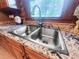 Stainless steel kitchen sink with granite countertops and a view of the outdoors at 24678 Augusta Hwy, Cottageville, SC 29435