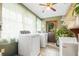 Well lit laundry room with modern appliances and a convenient exterior door for easy outdoor access at 24678 Augusta Hwy, Cottageville, SC 29435