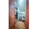 Walk-in pantry with shelving, wood floors, and open shelving for storing kitchen supplies at 24678 Augusta Hwy, Cottageville, SC 29435