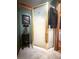 Corner shower stall with decorative glass door and gold frame, complemented by a stylish towel and unique decor at 24678 Augusta Hwy, Cottageville, SC 29435