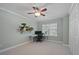 Office/bedroom with white desk, black chair, and shelving at 252 Howle Ave # C3, Charleston, SC 29412