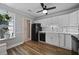 Bright kitchen showcasing stainless steel appliances and a view to a clean bathroom at 252 Howle Ave # C3, Charleston, SC 29412