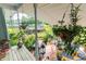 Back porch showing a beautifully decorated outdoor living area with a view of the lush green backyard at 274 Harvest Rd, Moncks Corner, SC 29461
