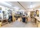 Basement workshop featuring an array of tools, workbenches, and ample lighting for various projects at 274 Harvest Rd, Moncks Corner, SC 29461