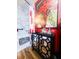 Bathroom featuring updated marble shower with built-in shelves and a red accent wall at 274 Harvest Rd, Moncks Corner, SC 29461