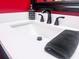 Bathroom vanity with a white sink, matte black faucet, and a black towel at 274 Harvest Rd, Moncks Corner, SC 29461