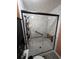 Elegant bathroom shower with marble-style tiles and glass doors, with black fixtures and a built-in seat at 274 Harvest Rd, Moncks Corner, SC 29461