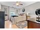 Bright bedroom featuring a comfortable bed, stylish decor, and light hardwood floors at 274 Harvest Rd, Moncks Corner, SC 29461