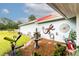 Beautiful backyard with a decorative water fountain, unique art, and lush greenery at 274 Harvest Rd, Moncks Corner, SC 29461