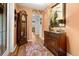 Grand foyer featuring a grandfather clock, a decorative rug, and wood floors at 274 Harvest Rd, Moncks Corner, SC 29461