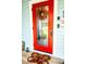 Stylish red front door adds curb appeal with seasonal wreath and welcomes visitors at 274 Harvest Rd, Moncks Corner, SC 29461