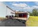 View of a two-car garage with an attached carport, offering plenty of parking and storage space at 274 Harvest Rd, Moncks Corner, SC 29461