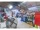 Cluttered garage interior featuring storage solutions, work area, and a visible overhead structure at 274 Harvest Rd, Moncks Corner, SC 29461