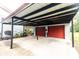Attached two-car garage and carport with a covered area offering convenience and additional parking options at 274 Harvest Rd, Moncks Corner, SC 29461