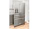 KitchenAid stainless steel refrigerator with ice and water dispenser, adjacent to cabinets at 274 Harvest Rd, Moncks Corner, SC 29461