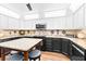 Modern kitchen with granite countertops, sleek black appliances, and a center island at 274 Harvest Rd, Moncks Corner, SC 29461