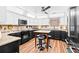 Modern kitchen with granite countertops, sleek black appliances, and a center island at 274 Harvest Rd, Moncks Corner, SC 29461