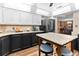Modern kitchen with granite countertops, sleek black appliances, and a center island at 274 Harvest Rd, Moncks Corner, SC 29461