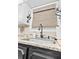 Kitchen sink with granite countertops, mosaic backsplash, and a black faucet at 274 Harvest Rd, Moncks Corner, SC 29461