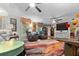 Bright and airy living room with wood flooring, leather seating, and plenty of natural light at 274 Harvest Rd, Moncks Corner, SC 29461