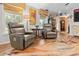 Inviting living room showcases hardwood floors, two leather recliners, and natural light from nearby windows at 274 Harvest Rd, Moncks Corner, SC 29461
