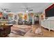 Comfortable living room featuring hardwood floors, leather recliners, and bright windows at 274 Harvest Rd, Moncks Corner, SC 29461