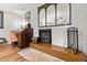 Cozy living room featuring a fireplace, decorative mirror, and a classic writing desk at 274 Harvest Rd, Moncks Corner, SC 29461