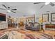 Open-concept living room and dining area with elegant furnishings and natural light at 274 Harvest Rd, Moncks Corner, SC 29461