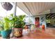 Spacious covered patio with colorful plants, outdoor furniture, and a welcoming atmosphere at 274 Harvest Rd, Moncks Corner, SC 29461