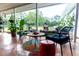Relaxing covered patio with comfortable seating and lush greenery, creating a tranquil outdoor space at 274 Harvest Rd, Moncks Corner, SC 29461