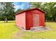 Red backyard shed with a slightly weathered exterior and a simple, functional design at 274 Harvest Rd, Moncks Corner, SC 29461
