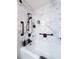 Updated marble shower with built-in shelves, rainfall shower head and a black grab bar at 274 Harvest Rd, Moncks Corner, SC 29461